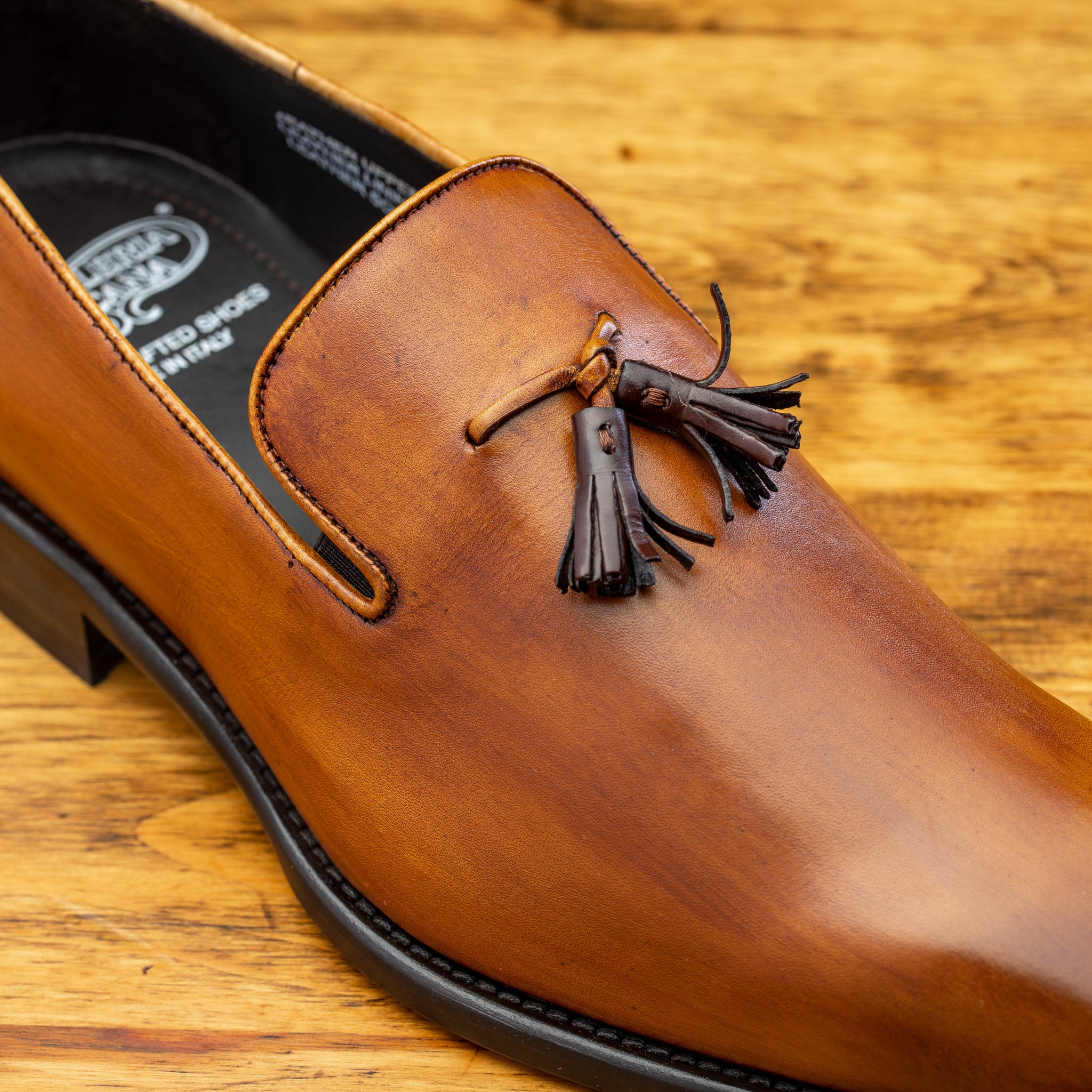 Up close picture of the brown tassel of Z993 Calzoleria Toscana Dark Caramel David Tassel Slip-On